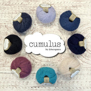 Cumulus yarn by Fyberspates, 8 balls in a circle surrounding the Cumulus logo